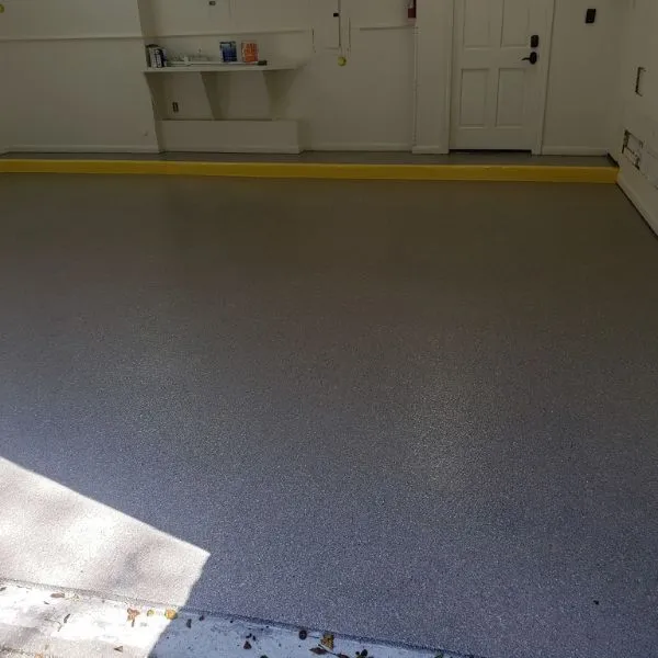 Coated garage floor with a flake epoxy finish