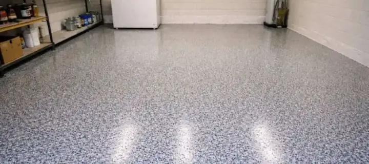 Coated garage floor with a clear top coat