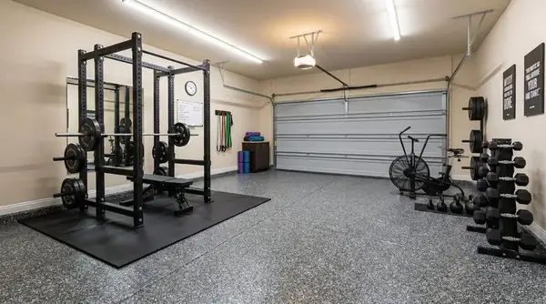 Gray flake epoxy floor in a garage gym, Riverton, Utah