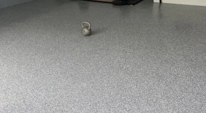 Gray flake epoxy floor with a kettlebell, Bluffdale, Utah