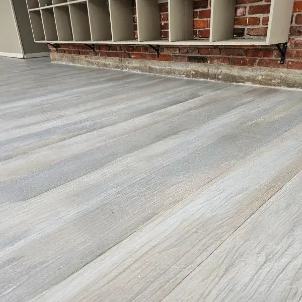Gray wood-grain finish below mudroom cubbies