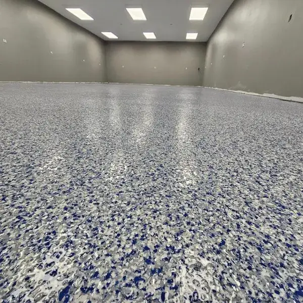 Blue and white flake epoxy floor in an open room, Cottonwood Heights, Utah