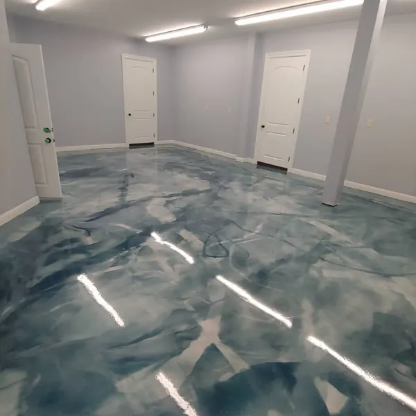 Blue and white metallic epoxy floor in a finished basement