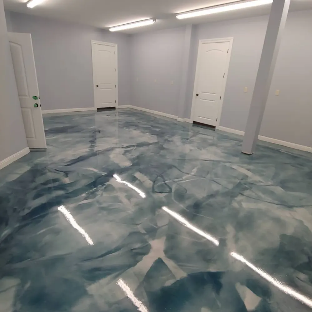 Blue and white metallic epoxy floor in a finished basement
