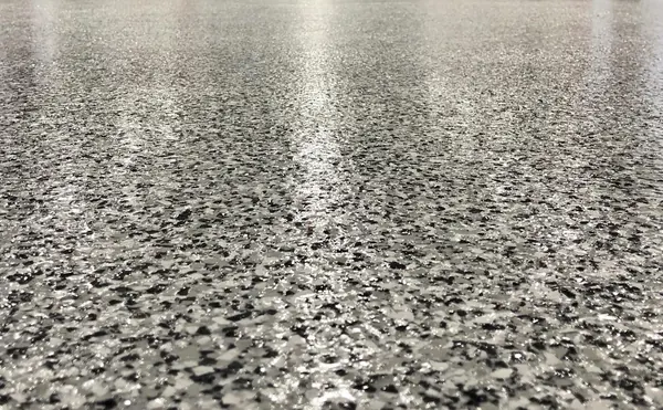 Gray and black flake epoxy floor in an auto shop, West Valley City, Utah