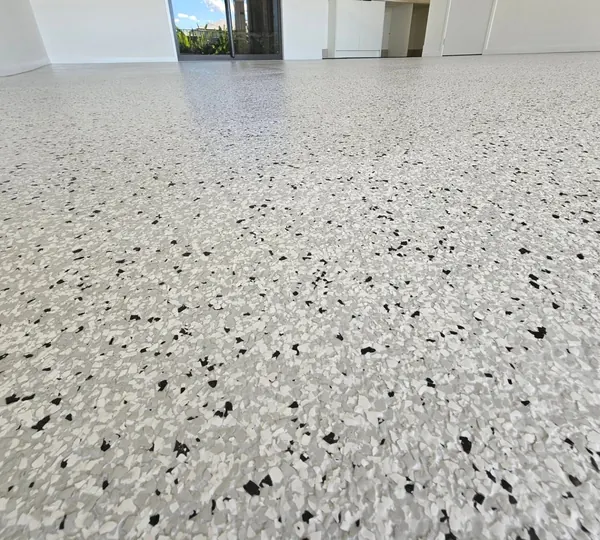 Light gray and black flake epoxy floor in a shop room, Riverton, Utah