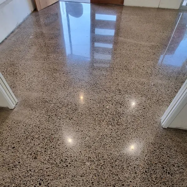 High-gloss exposed-aggregate polished concrete in a hallway, Salt Lake City, Utah